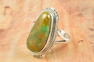 Genuine Crow Springs Turquoise set in Sterling Silver Ring. The Crow Springs Mine is located near Tonopah, Nevada. Created by Navajo Artist Larson Lee. Signed. 
